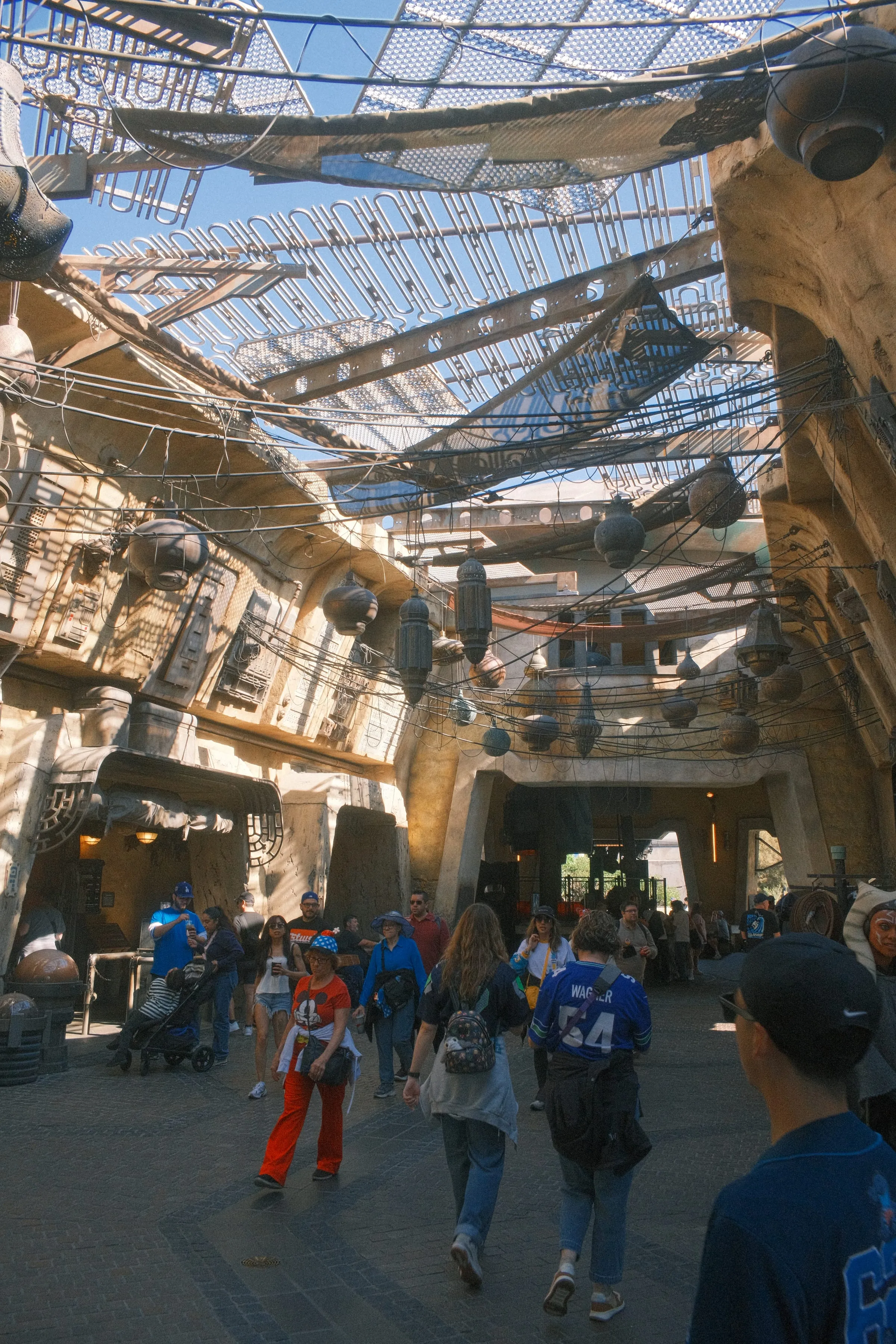 The market at Black Spire Outpost in Star Wars: Galaxy's Edge, lanterns and cargo nets strung overhead