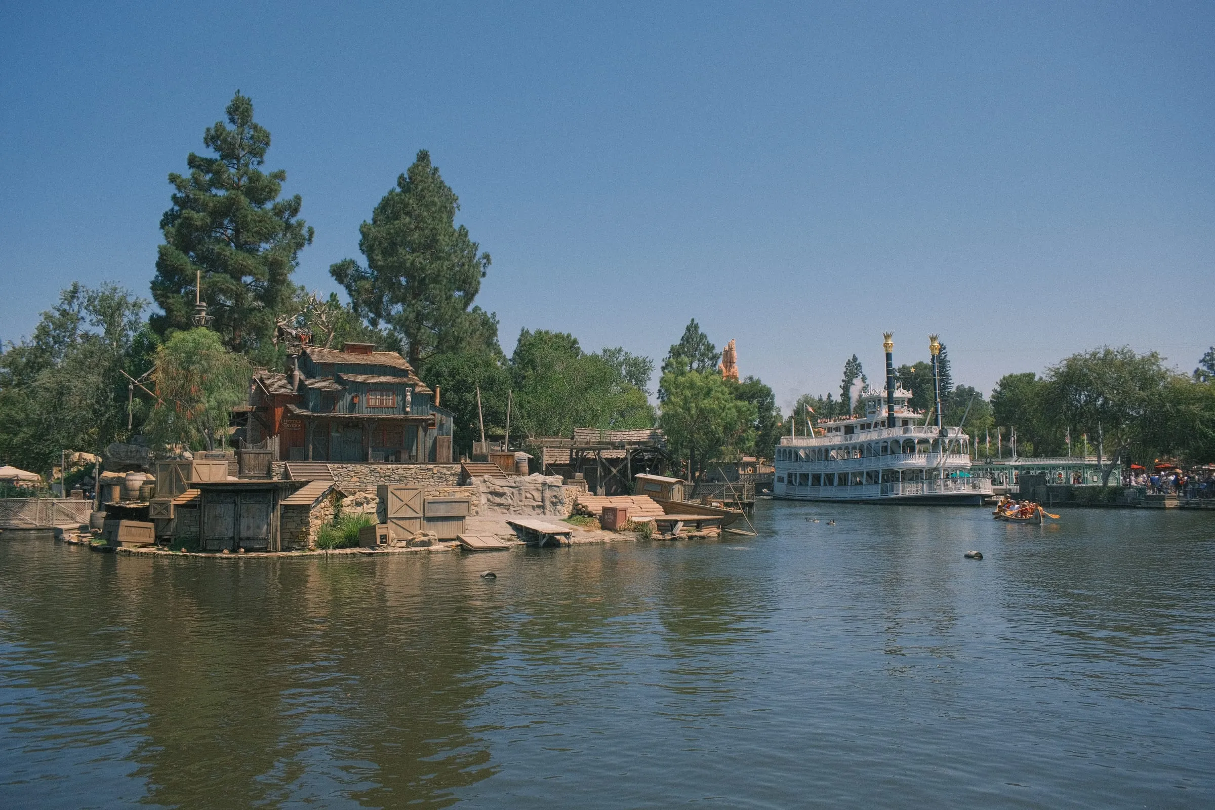 The Mark Twain riverboat rounding Tom Sawyer Island on the Rivers of America at Disneyland